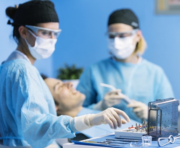 Oral surgeons reviewing patient file
