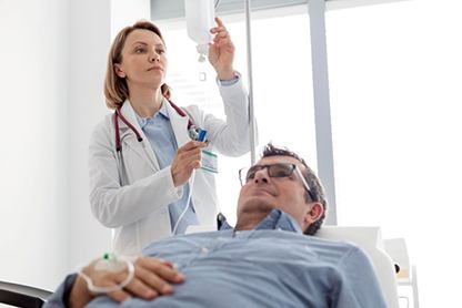 Candidate for IV dental sedation in Alexandria giving thumbs-up