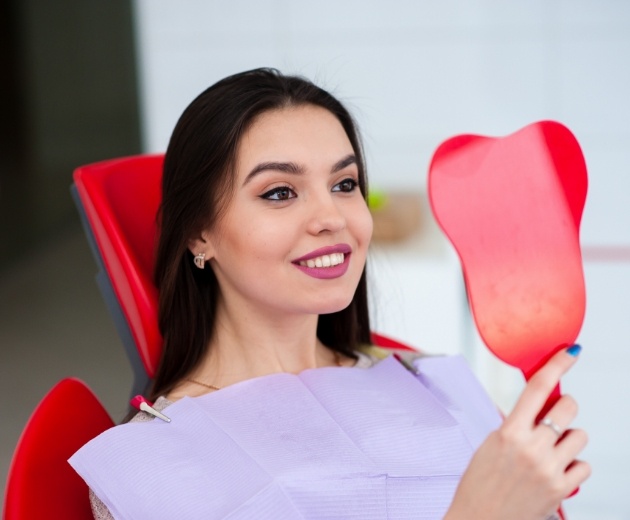 Facial cosmetic surgery outlines over patient's face