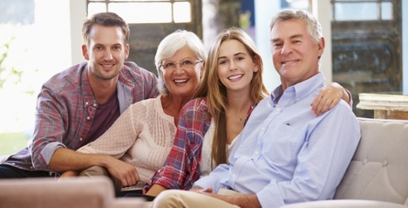 Man and woman smiling after general oral surgery procedures and technology treatment