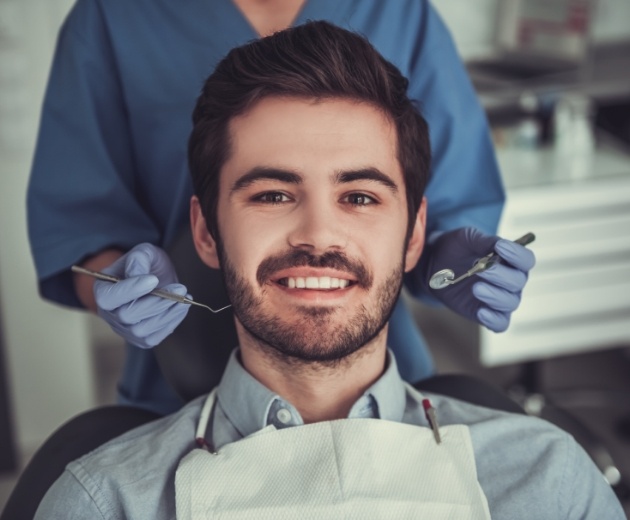 Group of young adults smiling after wisdom tooth extraction